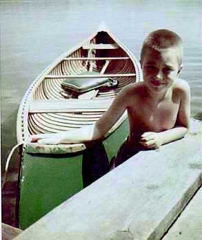 John Allen in 1954 with his grandfather's canoe (13 kB JPEG)